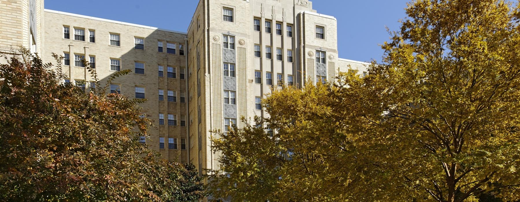 a building with trees in front of it