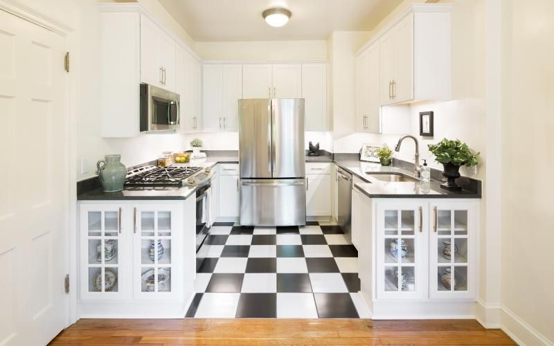 a kitchen with white cabinets